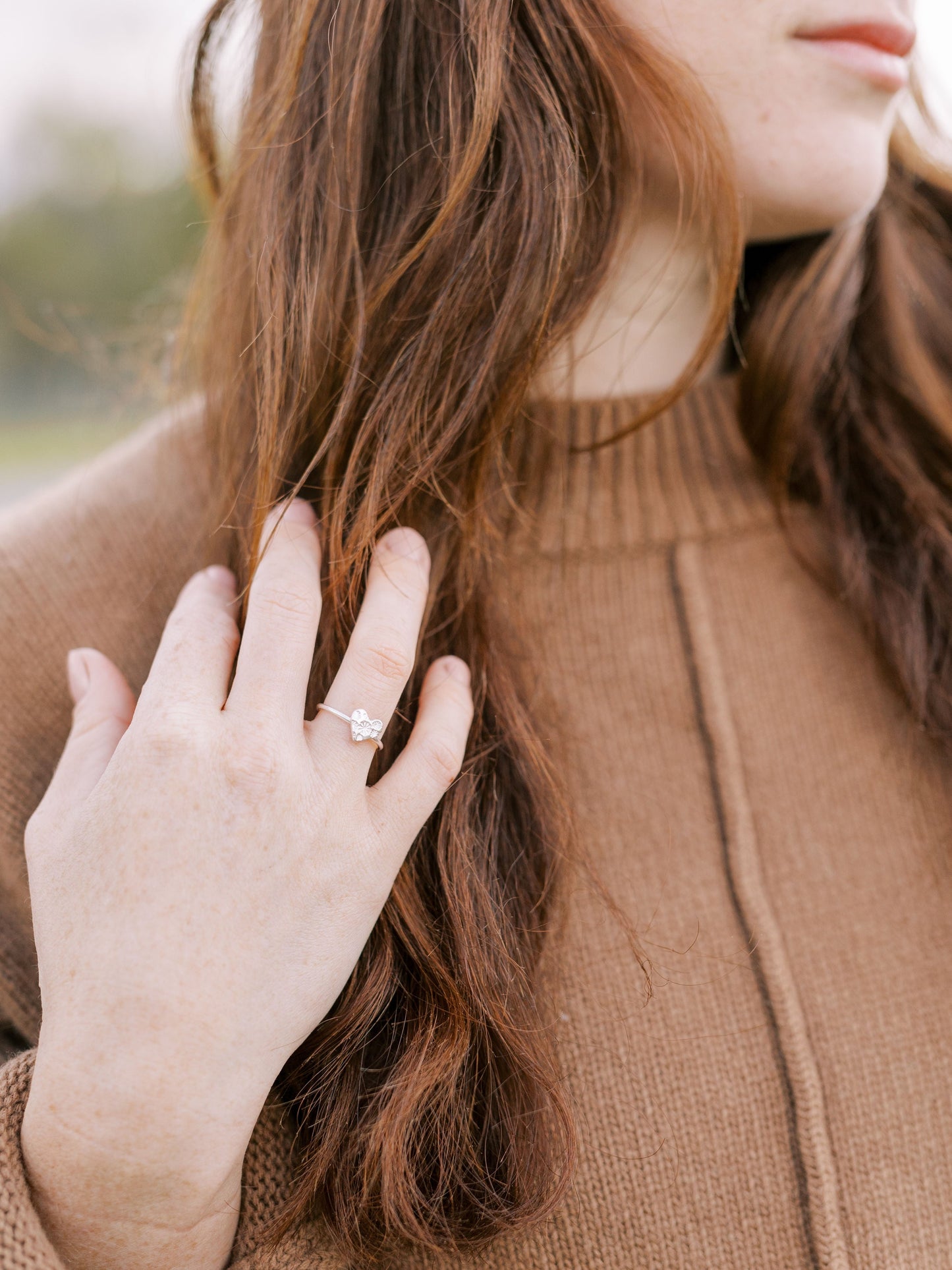 Model wearing silver heart ring by Elin Mair